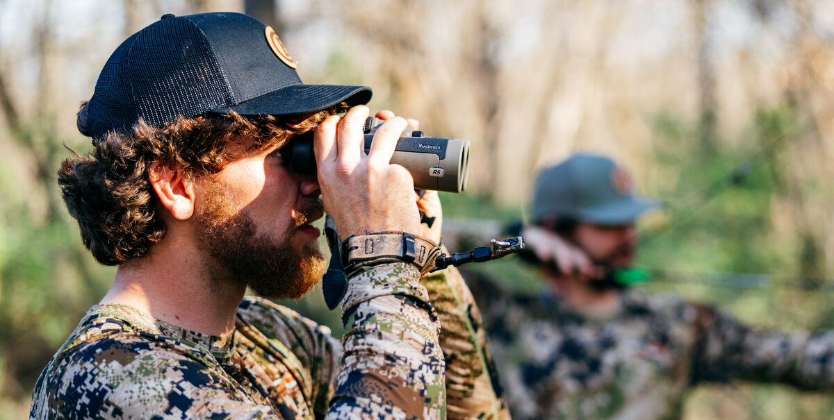 Man looking through binoculars 