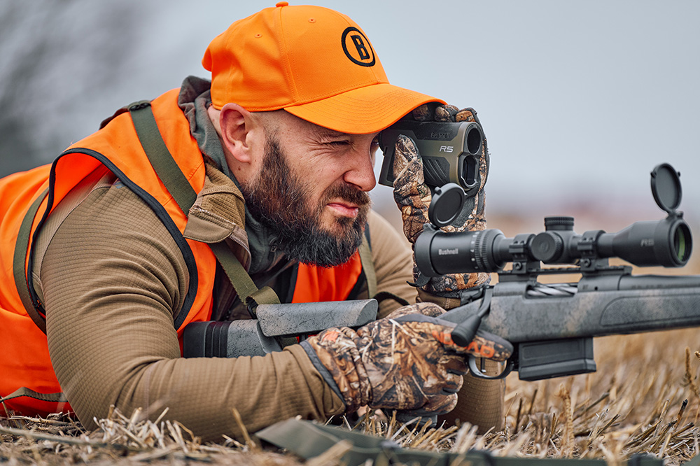 Man in tree stand archery hunting