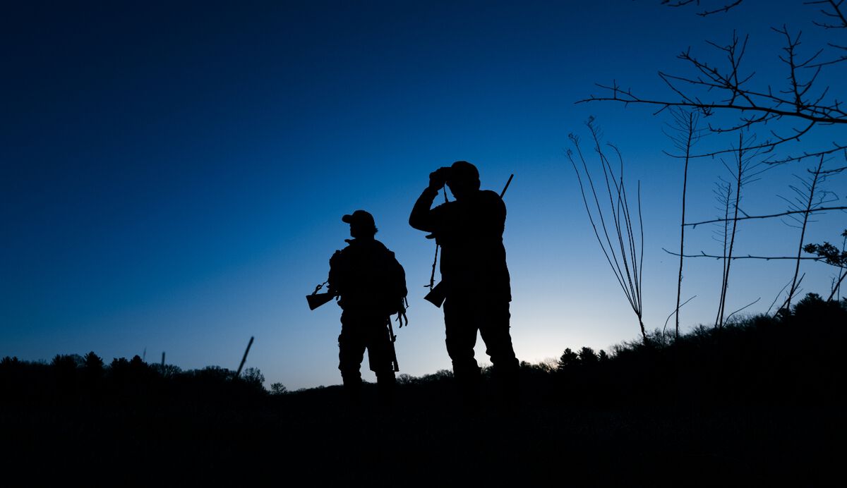 two hunters at night